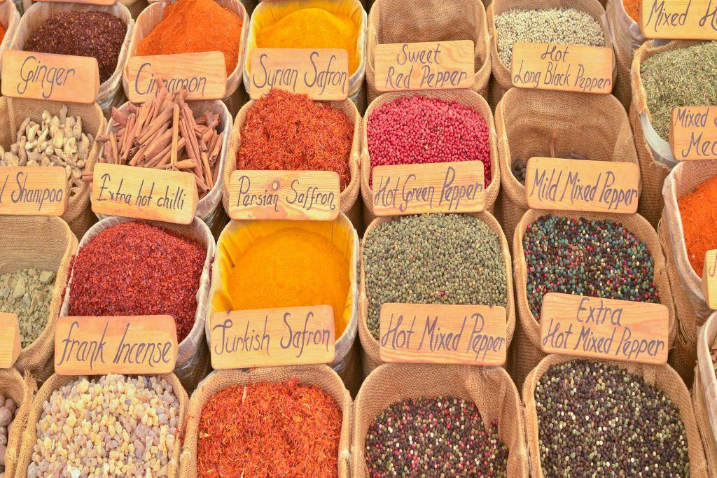 An array of spices in hessian bags.